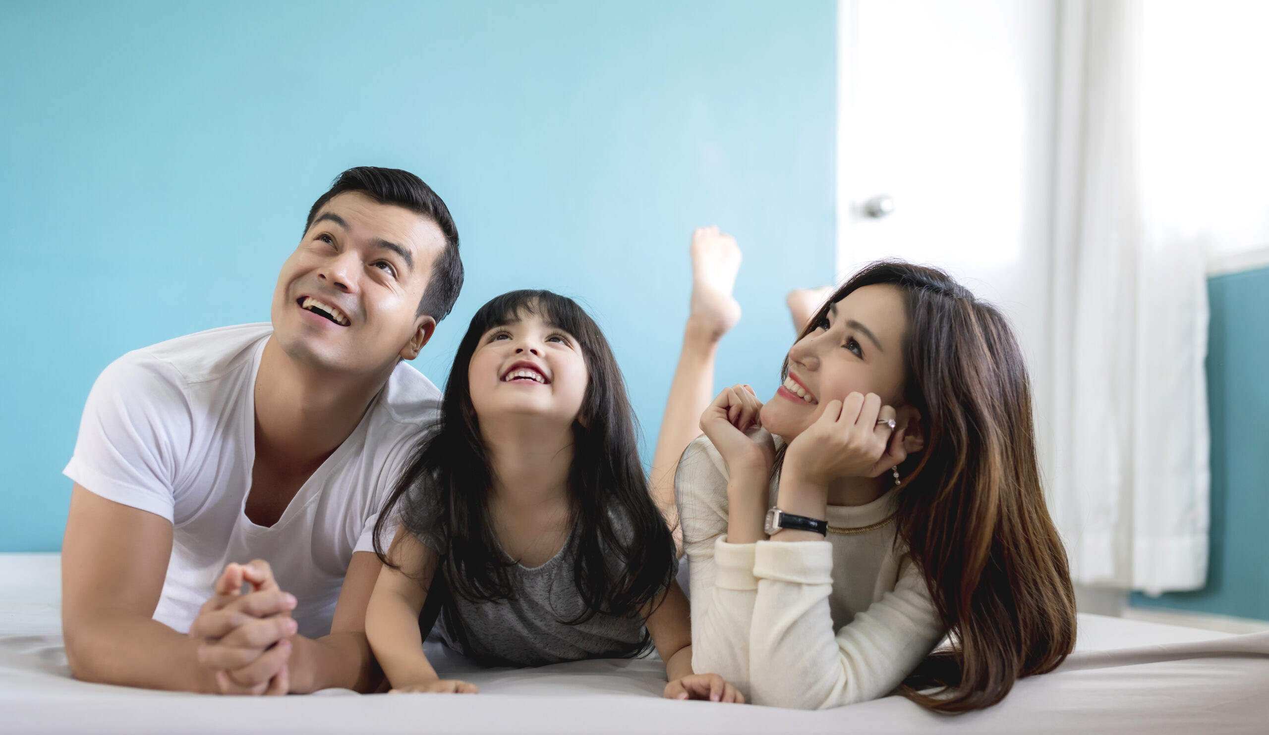 happy asian family mother father daughter making fun sleep play living room home-Debt Reliefer (About)